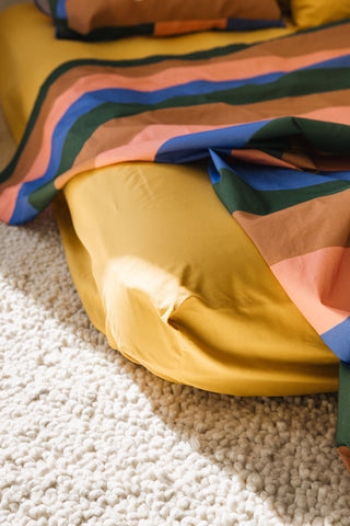 karavan clothing planet homeware collection fall winter 24 25 percale fitted sheet mustard